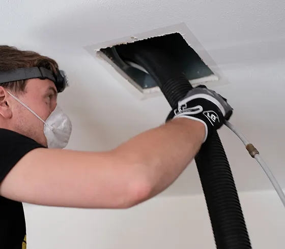 Technician performing reliable air duct cleaning services in Rome, GA, improving HVAC system efficiency and indoor air quality.