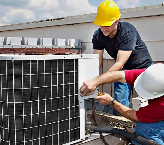 Technician repairing a residential outdoor HVAC system for reliable HVAC repairs in Summerville, GA.